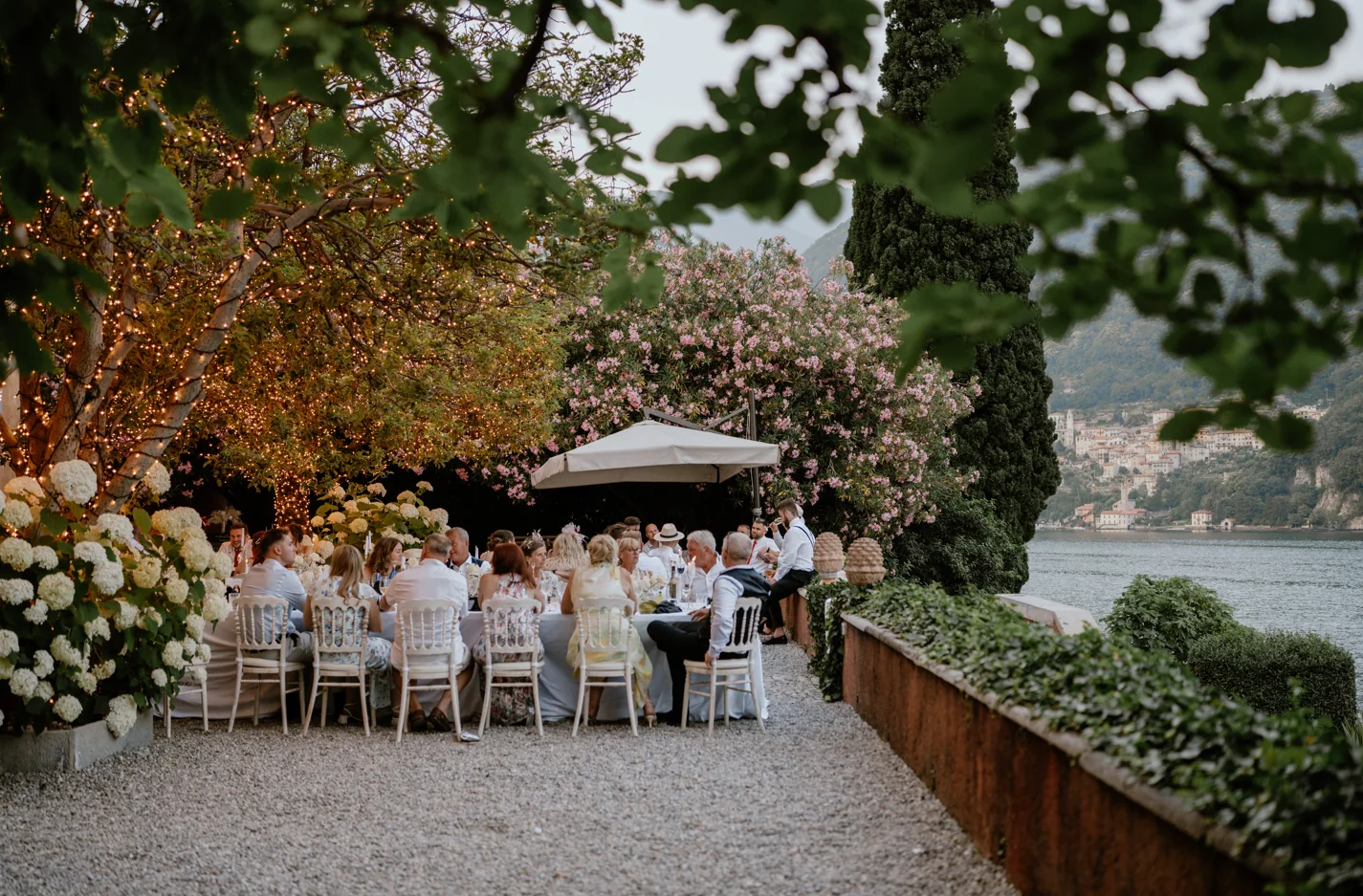 Guests dining outdoors at a destination wedding