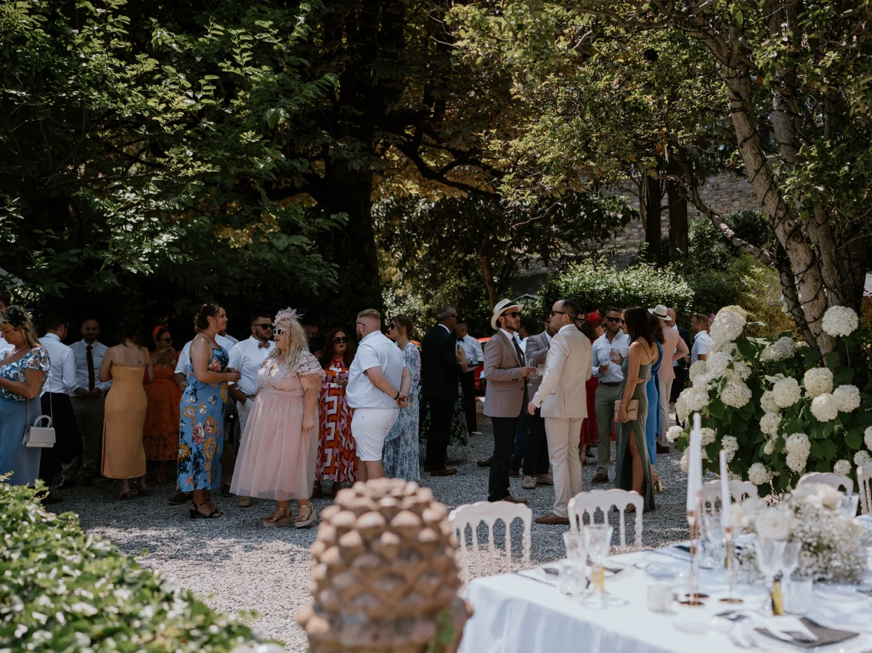 Wedding guests gathered together at a lakeside celebration